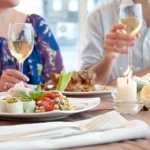 couple eating and drinking wine at one of the romantic restaurants in North Myrtle Beach