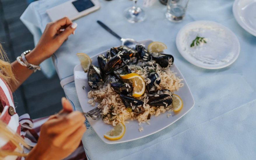 woman eating seafood in a north myrtle beach restaurant