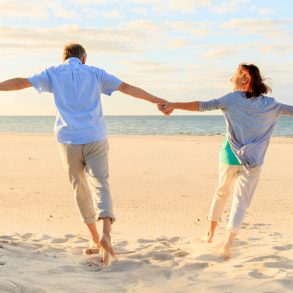 couple on the beach holding hands