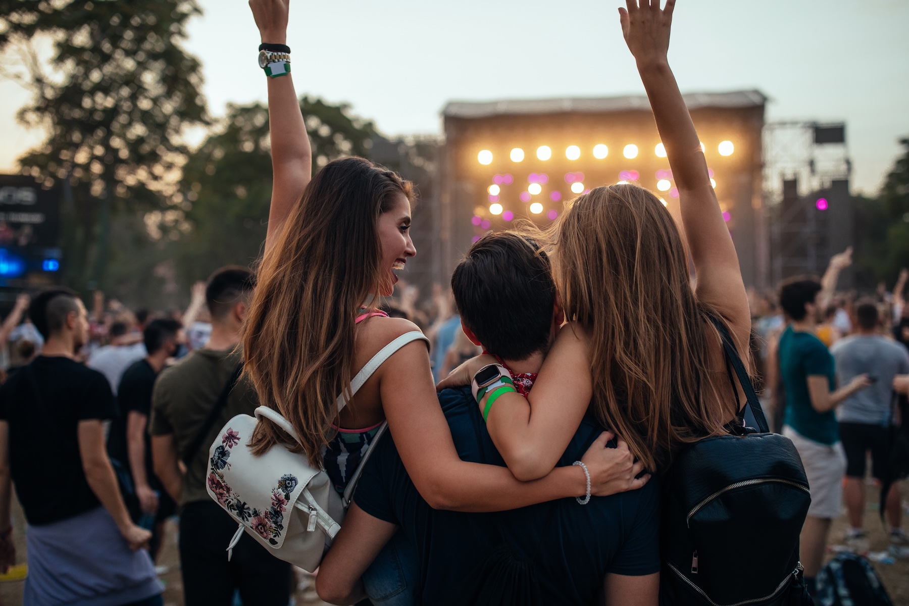 Young friends enjoying a music festival