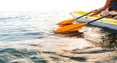 Cropped image of a young couple kayaking
