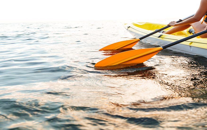 Cropped image of a young couple kayaking