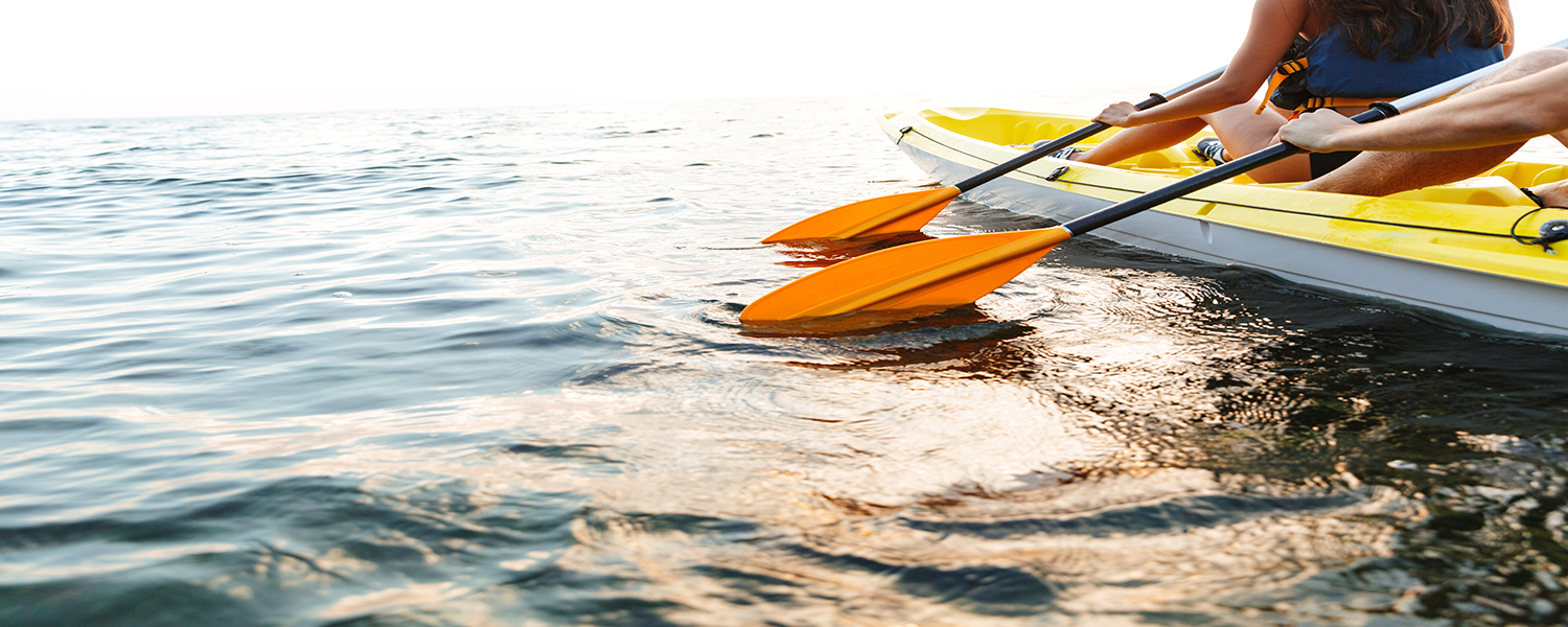 Cropped image of a young couple kayaking