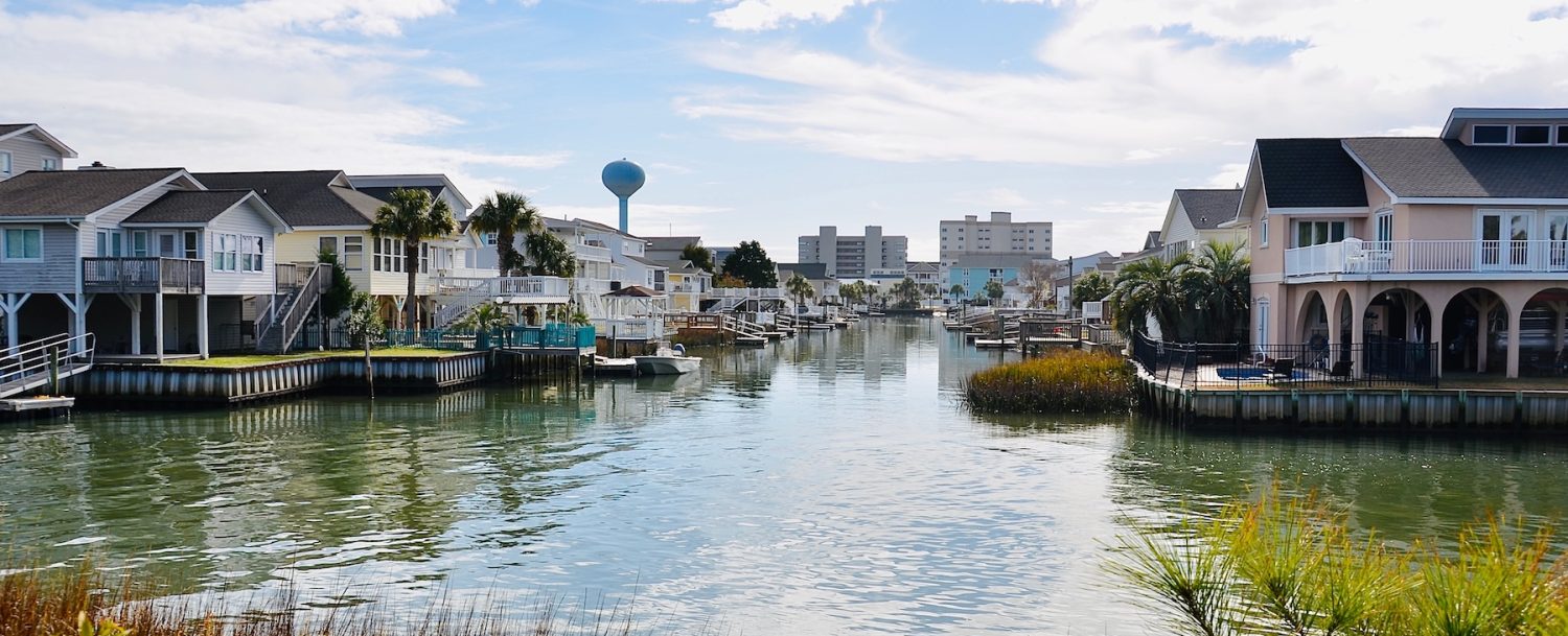 Waterfront homes with balconies and docks. Beautiful winter view in North Myrtle Beach, South Carolina, an attractive place for retirement.